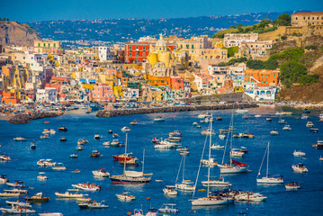 Procida, Italy-August 18, 2016: Overview of Porto Corricella in Procida Island, Italy - obrazy, fototapety, plakaty