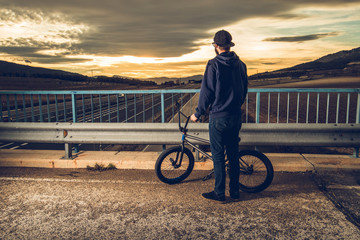 Guy with a bmx bike. BMX rider. Extreme urban sports concept