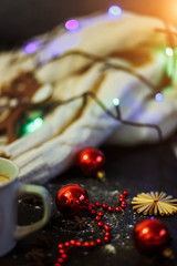 New year, Christmas, winter concept. Red beads, balls on black background with sweater