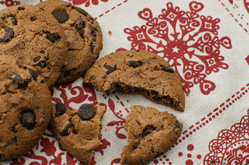 freshly baked chocolate chip cookies on rustic wooden table
