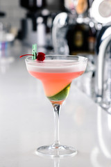 cosmopolitan coctail closeup on bar counter in a margagita glass