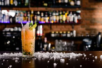 Orange caipiroska on the counter bar