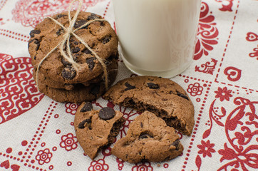 freshly baked chocolate chip cookies on rustic wooden table