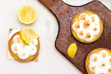 Meyer Lemon Tartlets with Lemon Curd on cutting board