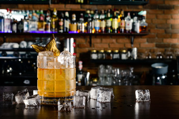 yellow cocktail on bar background, night club scenery