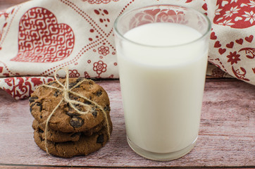 freshly baked chocolate chip cookies on rustic wooden table