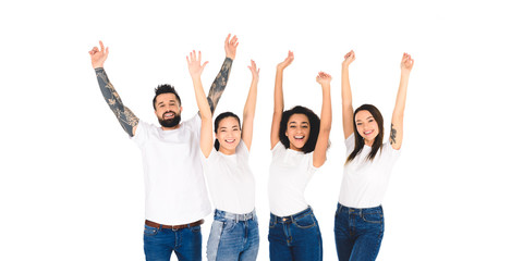 Fototapeta premium multicultural group of friends raising hands in air and smiling isolated on white
