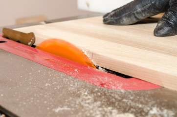 Orange circular saw in the carpentry workshop