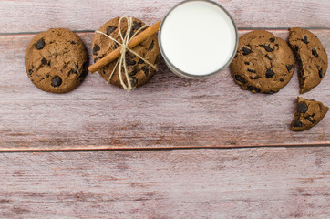 freshly baked chocolate chip cookies on rustic wooden table
