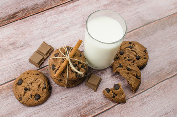 freshly baked chocolate chip cookies on rustic wooden table