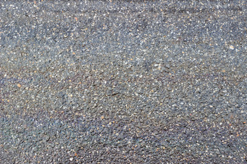 Wet asphalt pavement oil spill texture surface
