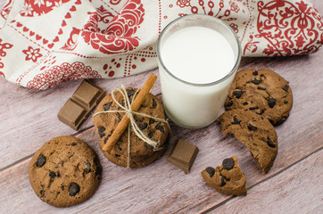 freshly baked chocolate chip cookies on rustic wooden table