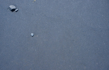 Black volcanic sand background