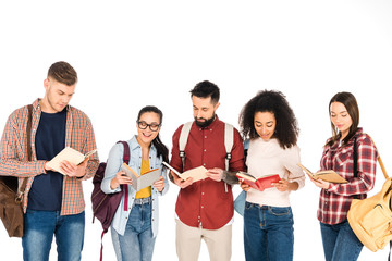 multicultural group of people reading books and holding backpacks isolated on white