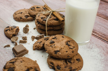 freshly baked chocolate chip cookies on rustic wooden table