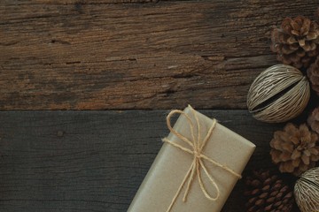 Simple eco friendly gift boxes package wrap with brown paper in old wooden table background, green present concept