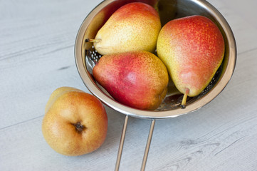 Pears on the wooden table.
