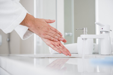 Close up of person washing hands with soap