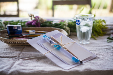 drawing paper with flowers on wooden table 