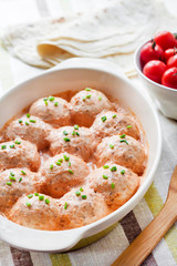 Chacken meatballs baked in creamy tomato sauce