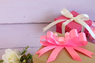 Colorful gifts box on pink background