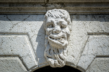 Venice facade decoration sculpture with scary face