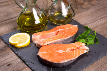 Delicious salmon steak on wooden table, close-up