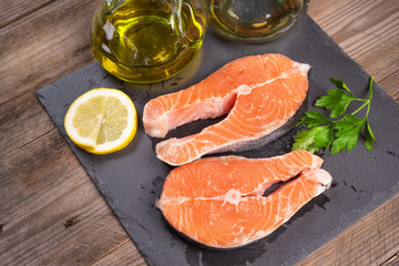 Delicious salmon steak on wooden table, close-up