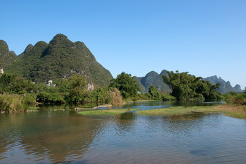 Fototapeta na wymiar Karst mountains and limestone peaks of Yulong River, Yangshuo, Guilin, China
