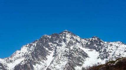 Fototapeta na wymiar Peak of the mountain covered by snow, winter in Sochi, Russia.
