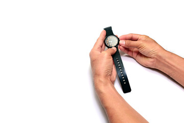 adult hand adjust time  with the black watch on white background isolated