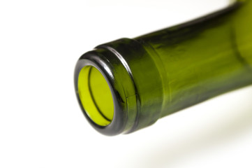 closeup of neck of empty bottle of wine for recycling on white background