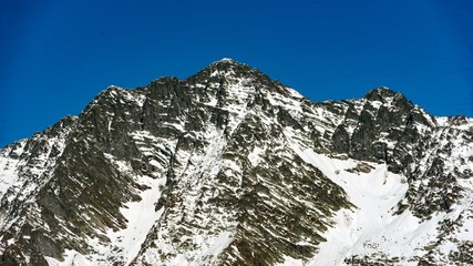 Peak of the mountain covered by snow, winter in Sochi, Russia.