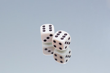 Game dice close-up in reflection. game dice six.