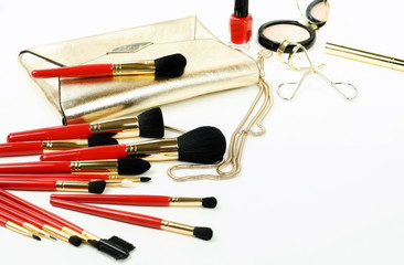 Makeup cosmetic products ,brushes set and  bag top view on white background. Professional makeup tools . Women accessories. Flat lay. Copy space