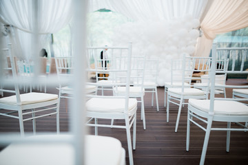 White chairs, beautiful decoration for wedding day.