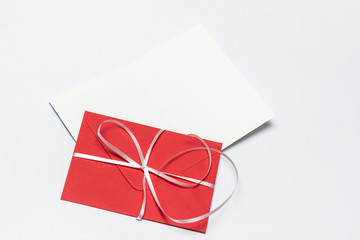 Blank red envelope isolated on white background with shadows. Mockup, Christmas mailing. declaration of love.