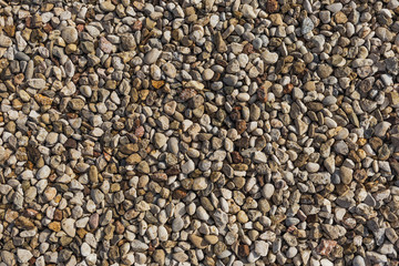 Abstract top view background of many stones. Horizontal color photography.