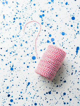 Red Twine String Roll On White Background