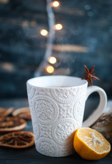 Close-up of Christmas tea with lemon on dark background