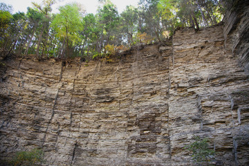 geological limestone cliff formation showing different layers of rocks and geology