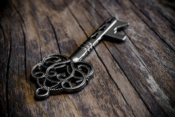 old iron key on woodenn table