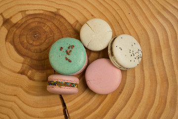 Colorful French or Italian macaron on the wood table with copy space for background. Macarons or macaroons is French dessert