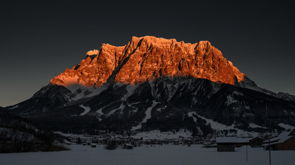 sunset glowing peak of huge alpine mountain chain in tirol