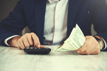 man hand money with calculator