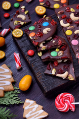 Dark chocolate bark with cashew and pistachio nuts, multicoloured sweets, dried cranberries and cherries