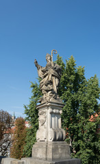 Fototapeta na wymiar Sculpture at Charles Bridge on Vltava river in Prague, Czech Republic 