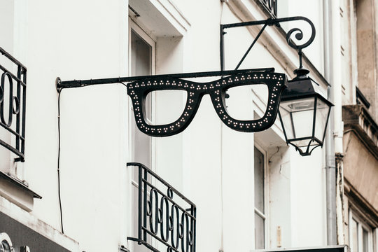 Sign board in shaped of glasses on a European street