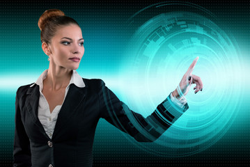 Young business lady works with virtual graphic interface in futuristic office