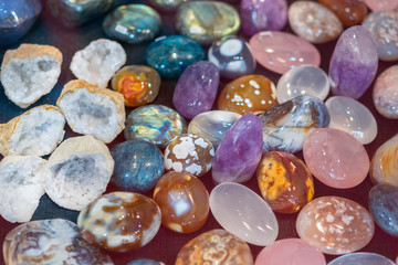 Heap of various colored gems. Colorful gemstones. Natural Polished Gemstone Semi Precious Rocks Colorful Background Texture Close Up Phot
